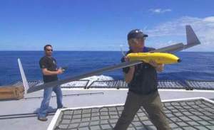 Crew members launch a Drone from the deck of the Sea Shepherd