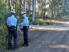 Tas policeman relieving himself in bush