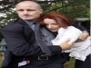 Terrified Juliar Gillard clings to her bodyguard
